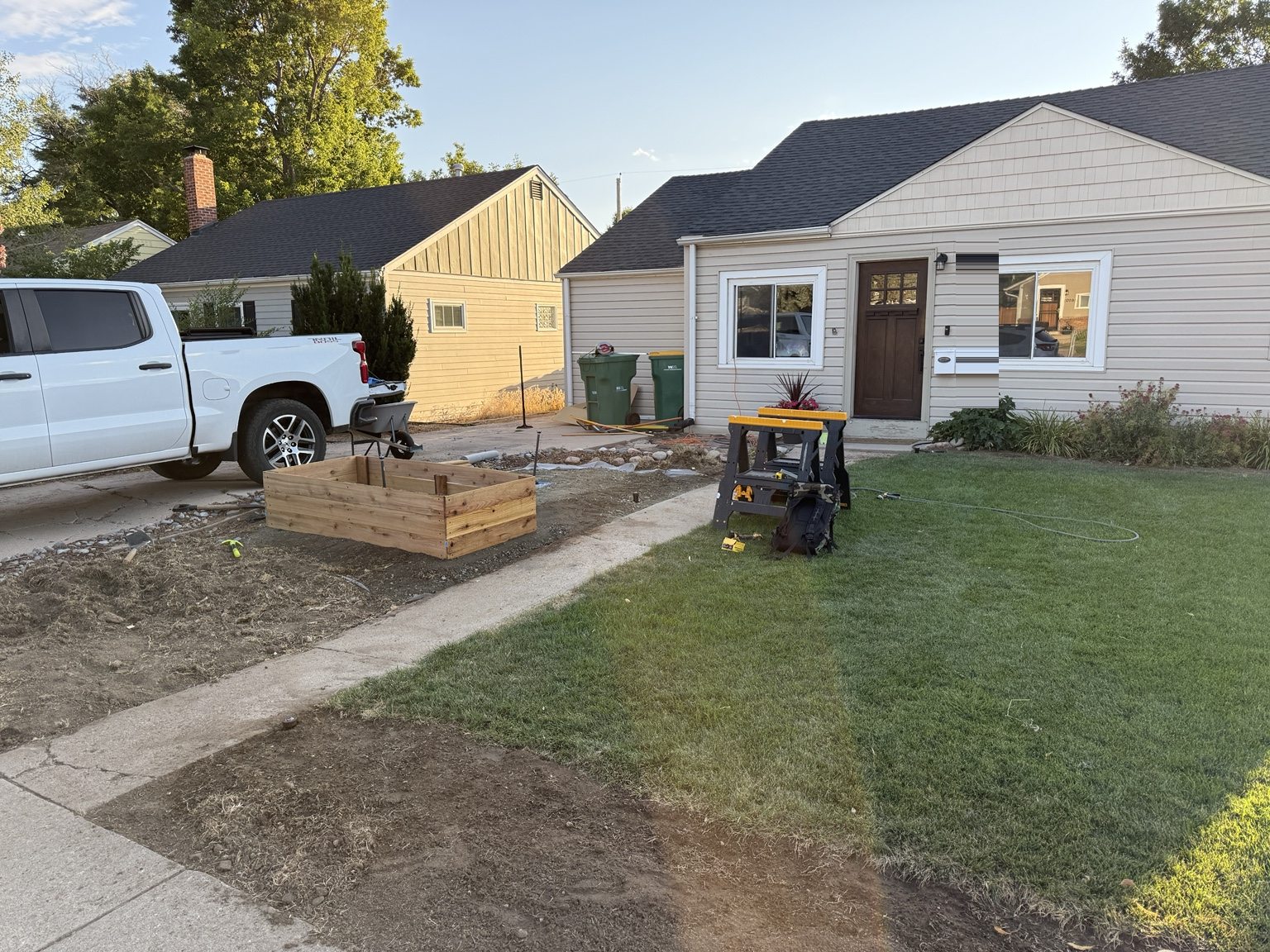 Front-yard excavation with a raised planter frame in progress